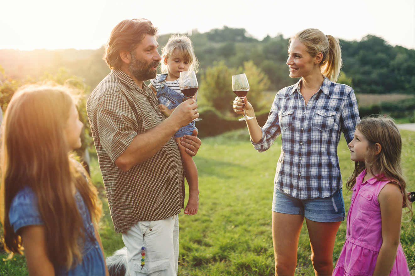 A family enjoying a day in the vineyard