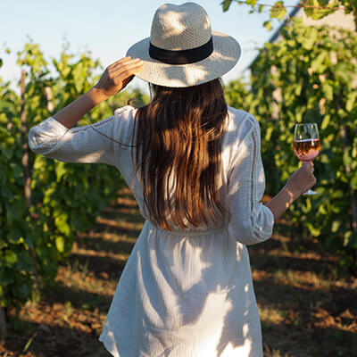 woman walking in vineyards